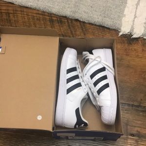 Women’s black and white adidas superstars 8 1/2